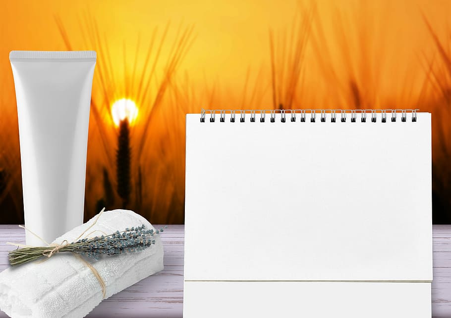 white paper beside towel, wellness, cosmetics, calendar, cream