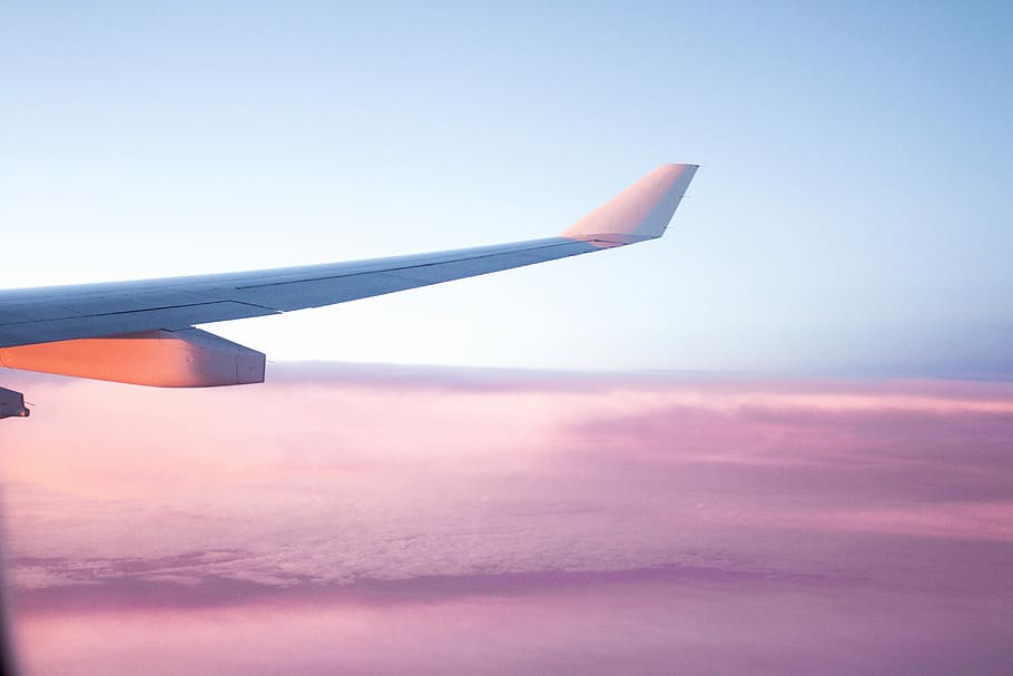 aerial view of airplane wing, airplane travelling above white clouds HD wallpaper