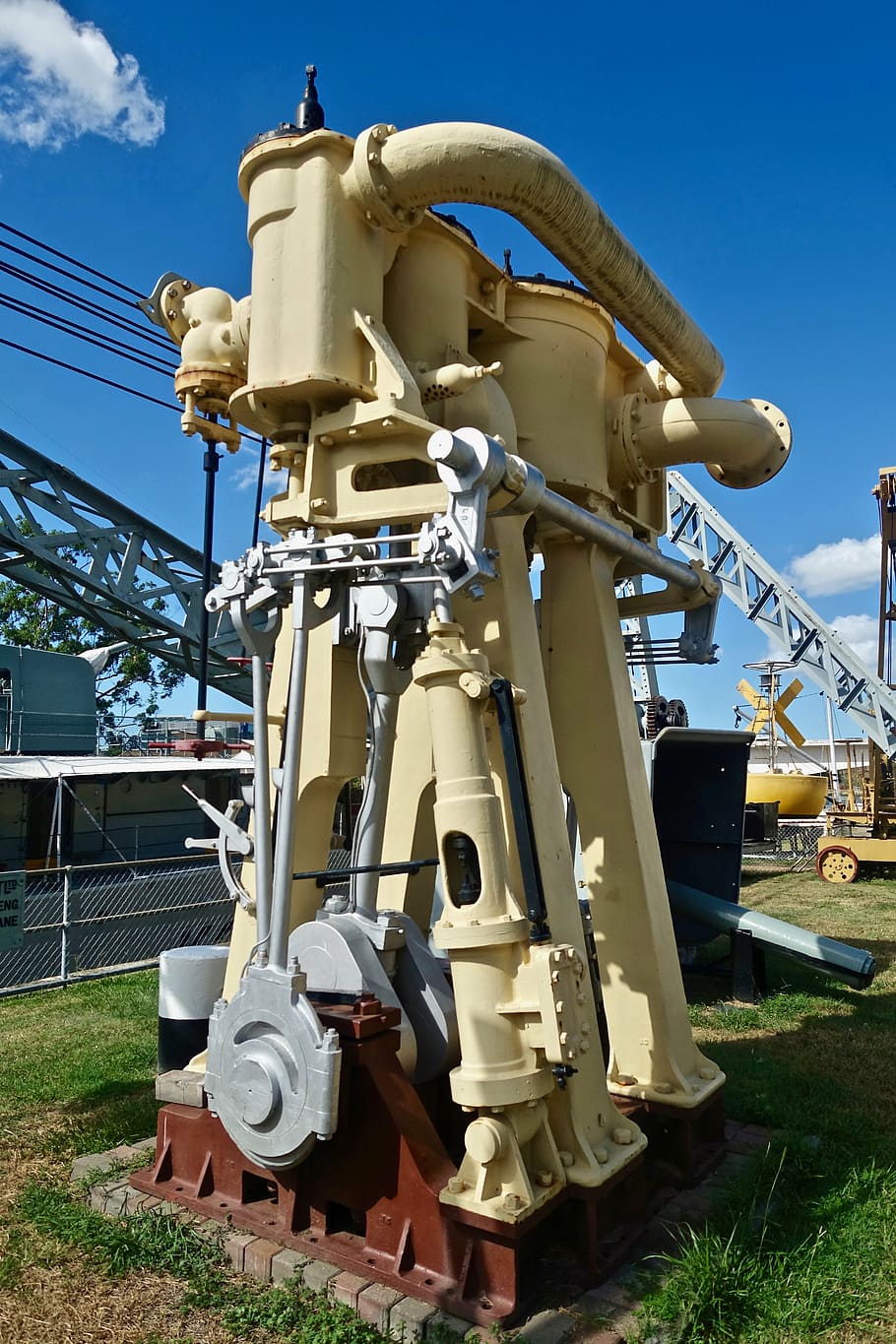 beige industrial equipment on green grass, engine, metal, power HD wallpaper