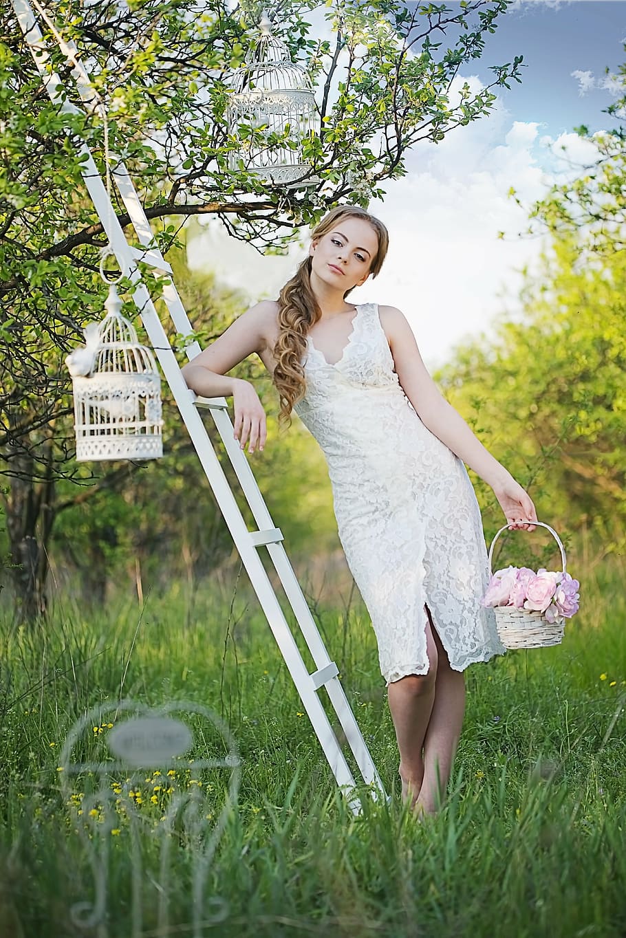 woman wearing white lace dress holding basket leaning on white wooden ladder with birdcage, HD wallpaper