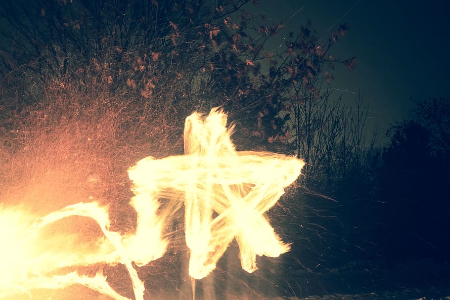 timelapse photo of person making star using fire, white star LED light HD wallpaper