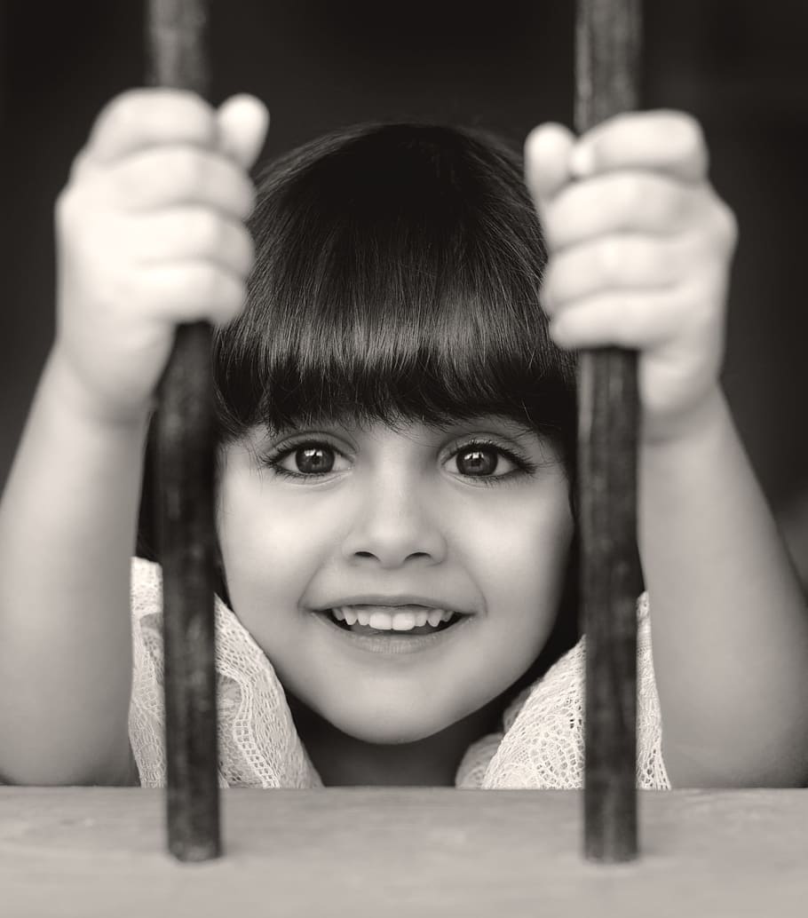 smiling girl behind bars, kids, little, child, childhood, happy, HD wallpaper