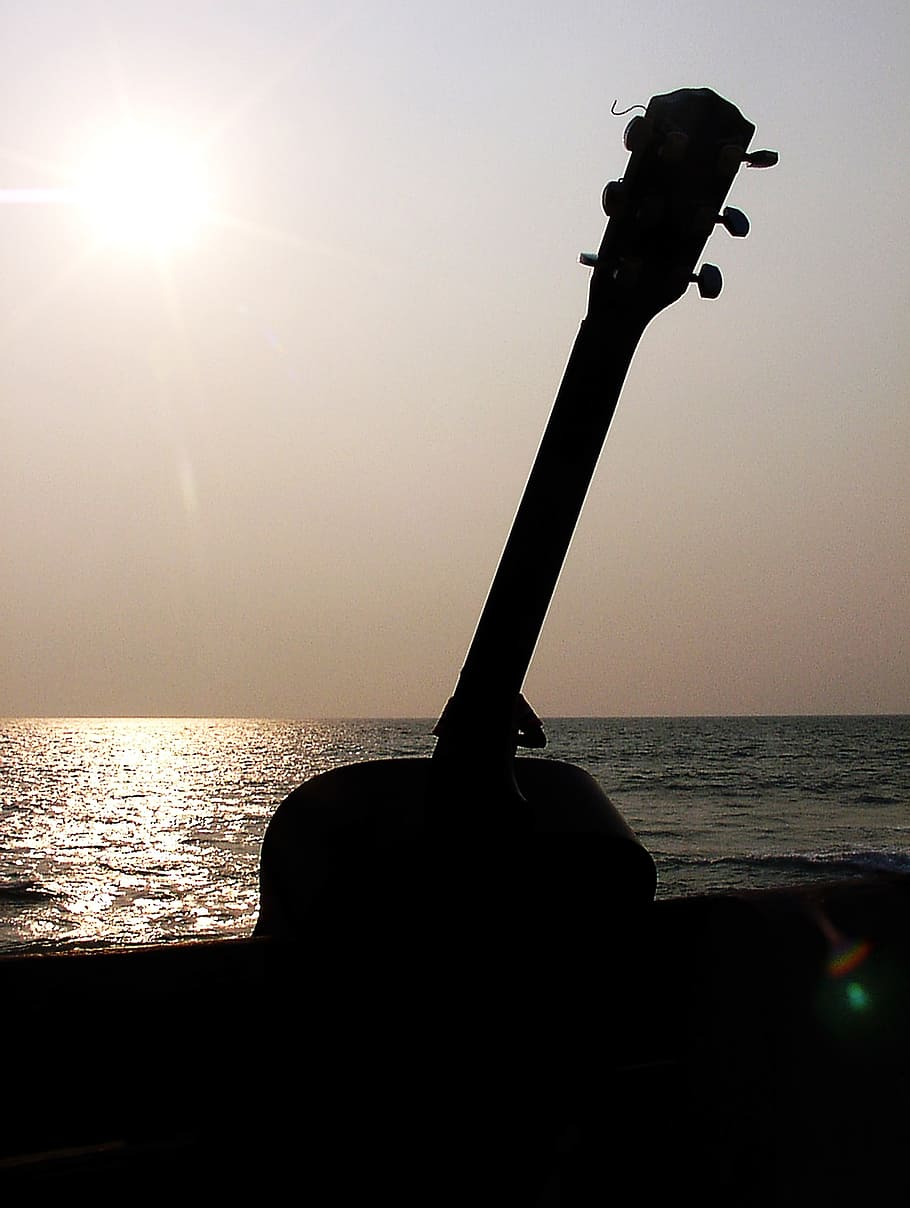 guitar, sun set, guitar on bench, afternoon, sunlight, lens flare