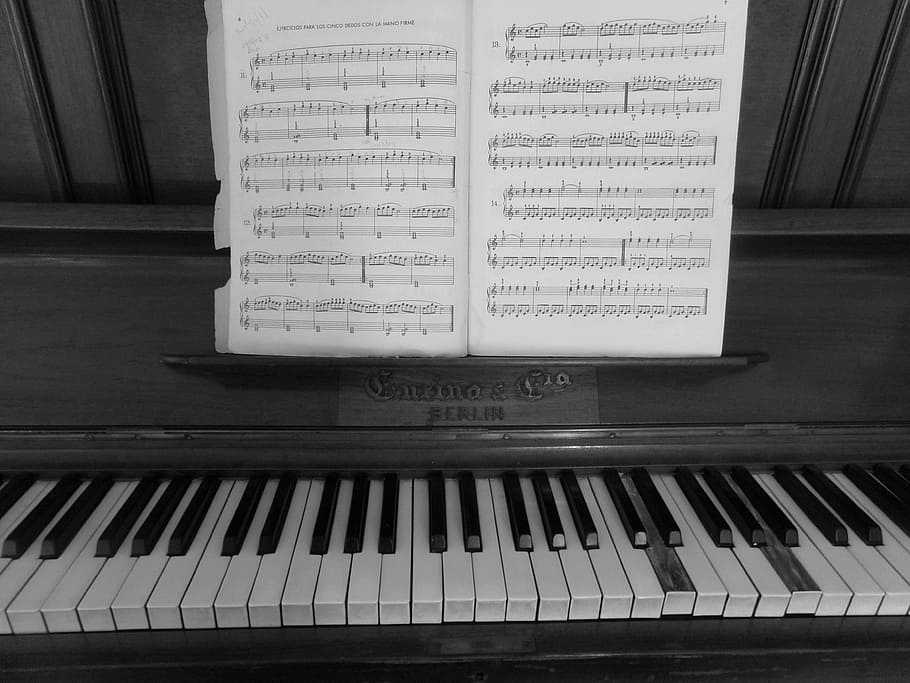 4320x900px-free-download-hd-wallpaper-music-sheet-on-upright-piano-black-and-white-keys