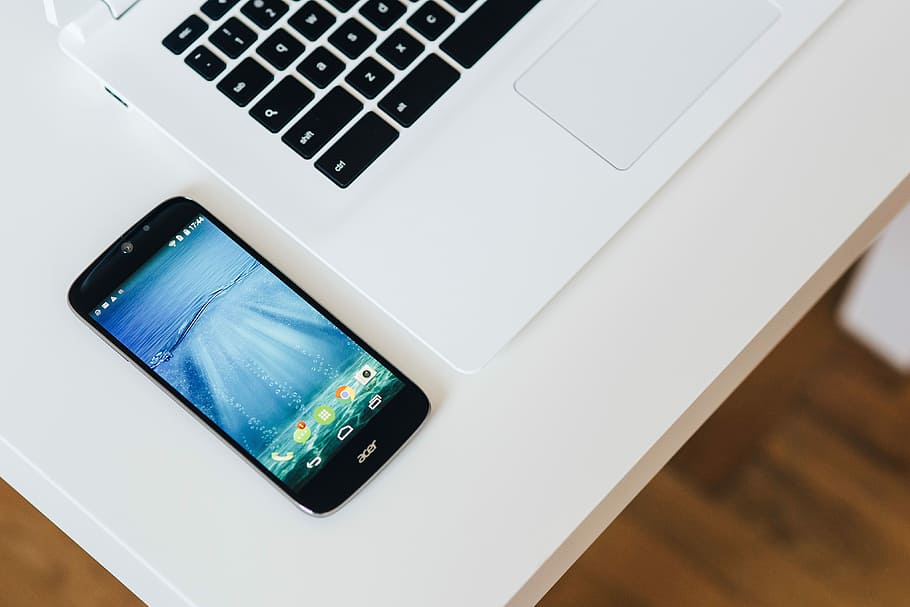 White laptop with smartphone and headphones, notebook, mobile phone HD wallpaper