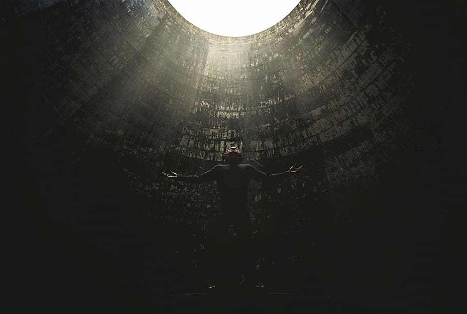 man standing under hole, untitled, person, light, sunlight, architecture HD wallpaper