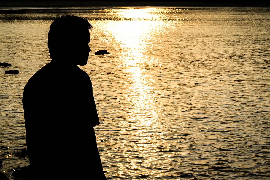 sea, sun, sky, water, silhouette, one person, standing, sunset HD wallpaper