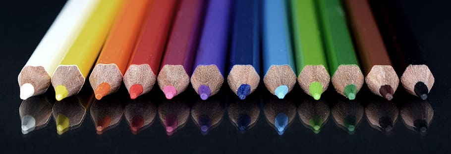 close photo of twelve assorted color pencils, colour pencils
