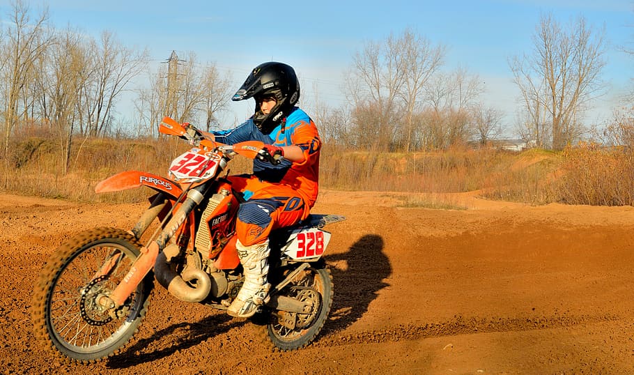 boys riding dirt bikes