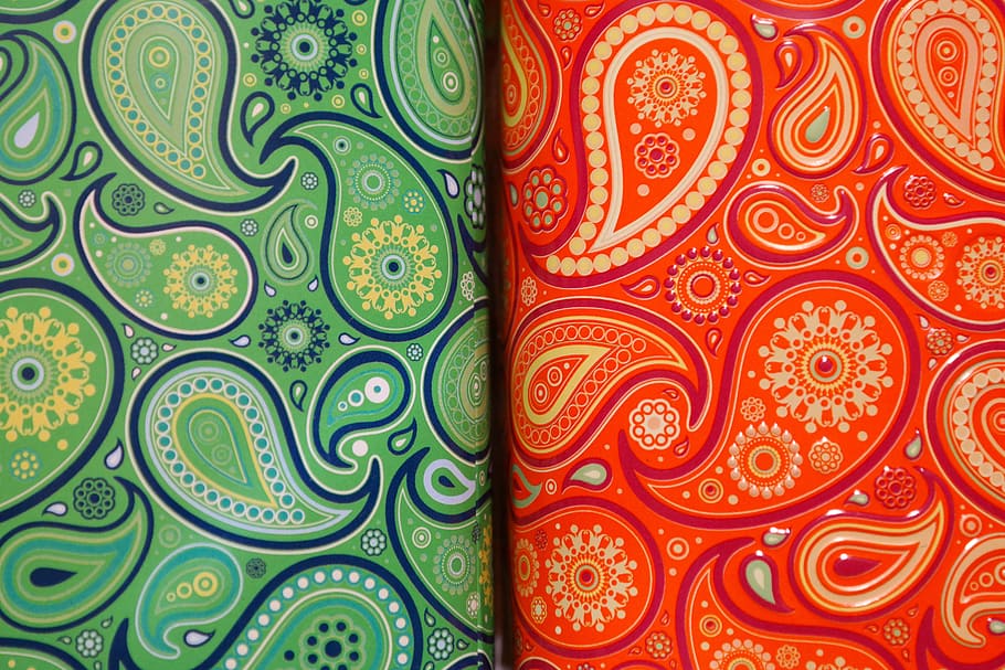green and red paisley textiles, tea tins, cans, colorful, pattern