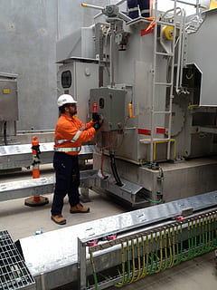man touching industrial machine, electrical services, hv testing HD wallpaper