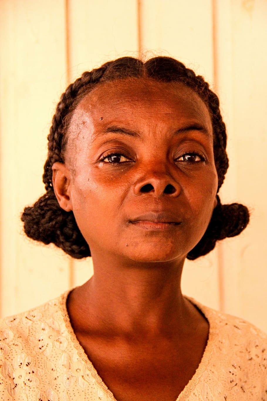black braided-hair woman in beige top, madagascar, africa, smole