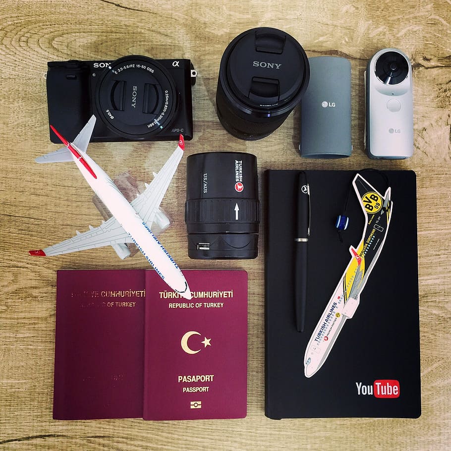 Miniture planes with passport and Lens, business, documents, photos