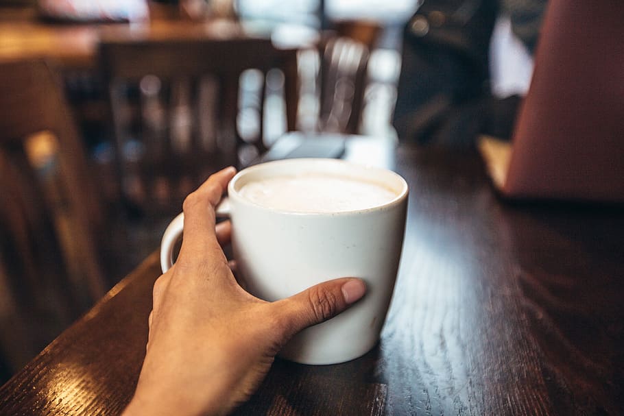 Cafe coffee cup being held in a hand, food/Drink, drinks, coffee - Drink