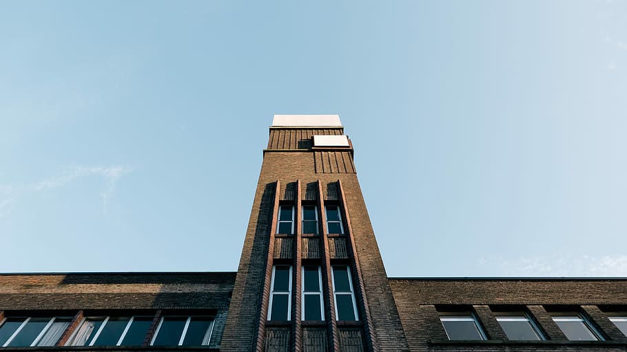worm's-eye view of concrete building, brown concrete building under clear blue sky HD wallpaper
