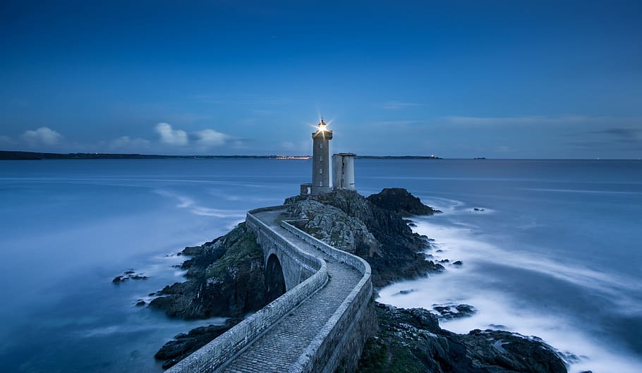 gray concrete lighthouse near body of water, coast, ocean, rocks