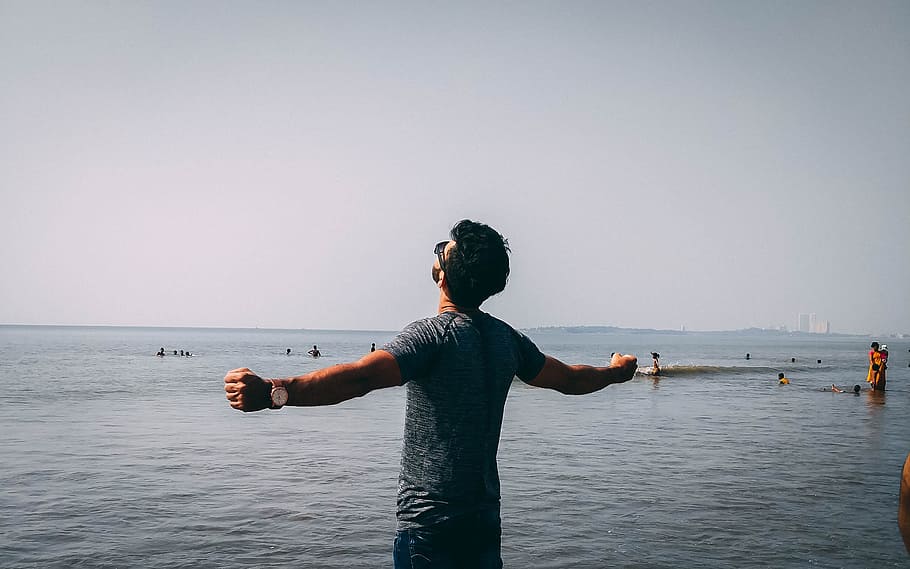Photo of Man Wearing Gray Shirt Near Sea, beach, care, dawn, daylight HD wallpaper