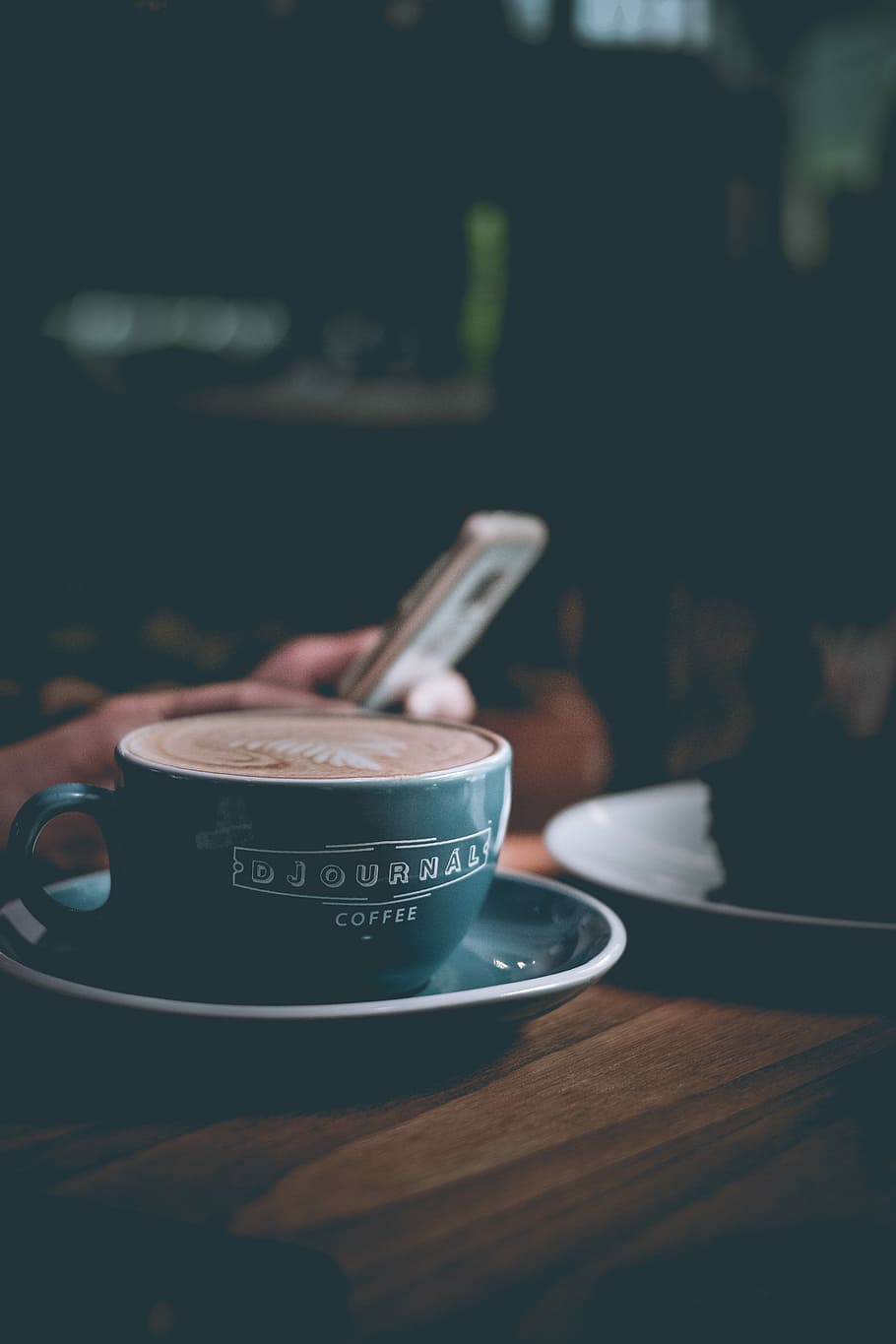 selective focus photography of blue cup and saucer, teal cup and saucer on brown surface HD wallpaper
