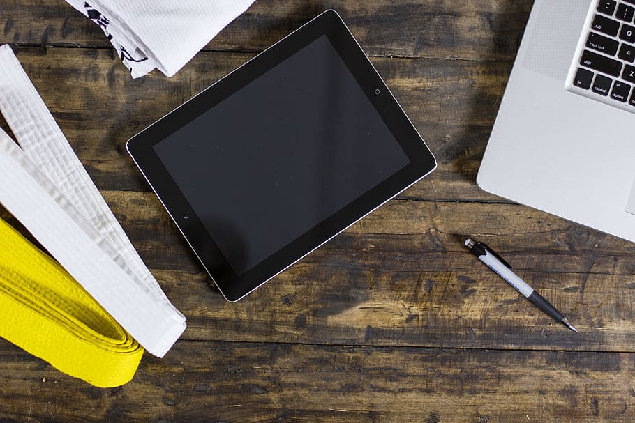 black iPad beside silver MacBook and retractable pen, wooden table, HD wallpaper