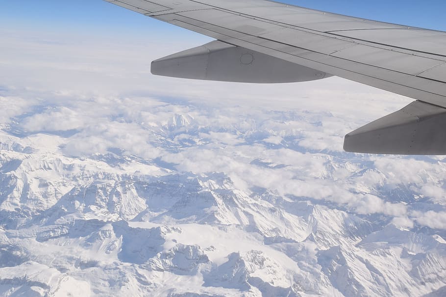 passenger plane flying over snow covered mountains, flight HD wallpaper
