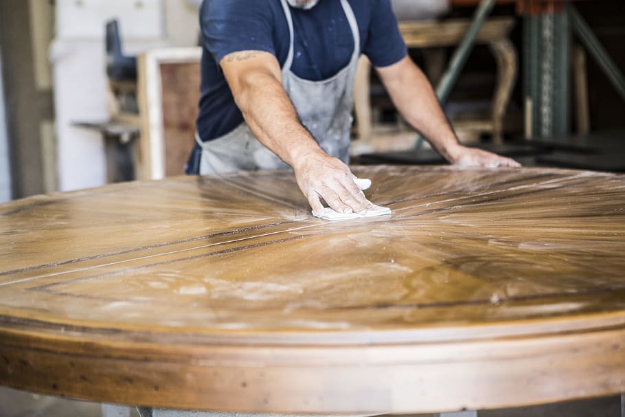 sanding a table, round brown wooden table, person, worker, walnut HD wallpaper