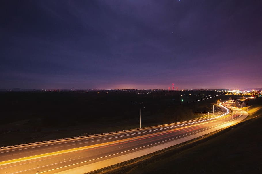 time lapse photography of vehicles traveling on road at night HD wallpaper