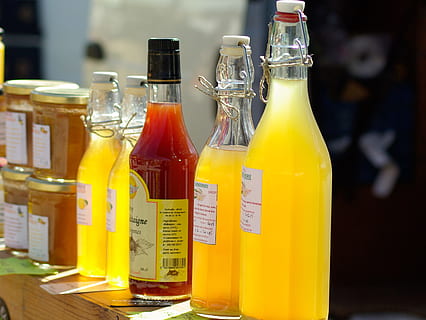 assorted glass bottles on brown wooden surface, Fruit Juices HD wallpaper