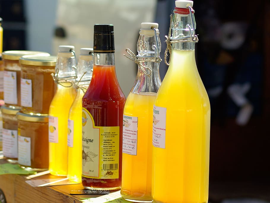 assorted glass bottles on brown wooden surface, Fruit Juices HD wallpaper
