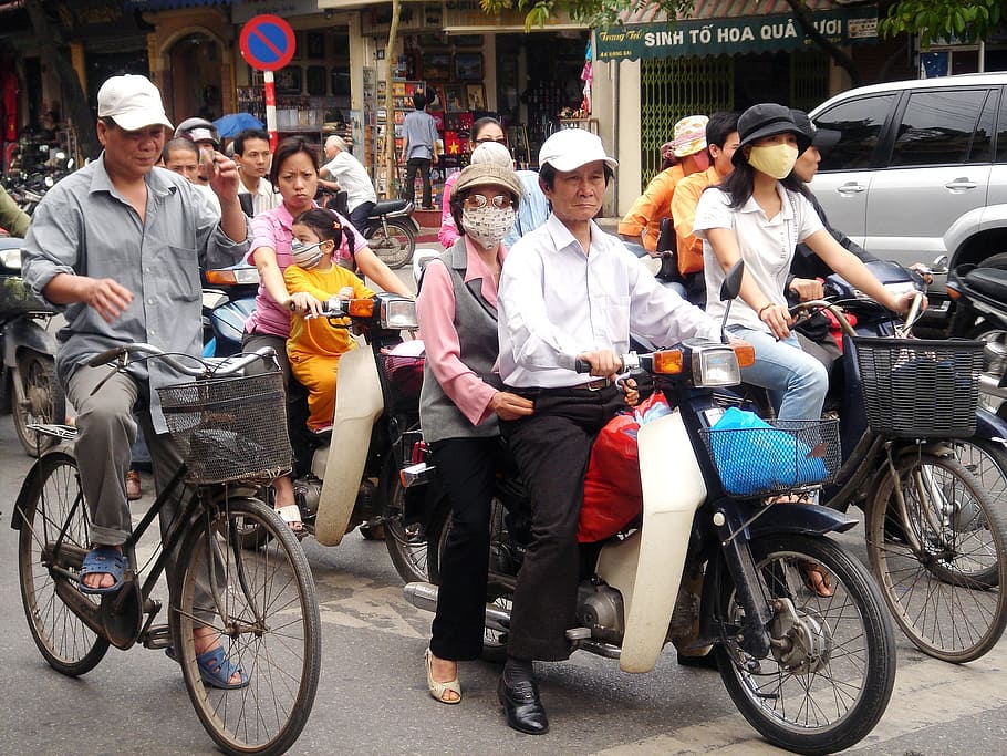 man and woman riding motorcycle during daytime, couple, street