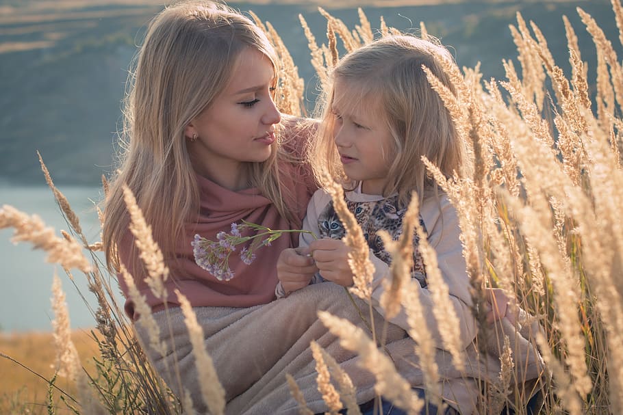 blonde haired woman and child sitting on wheat field during daytime, HD wallpaper