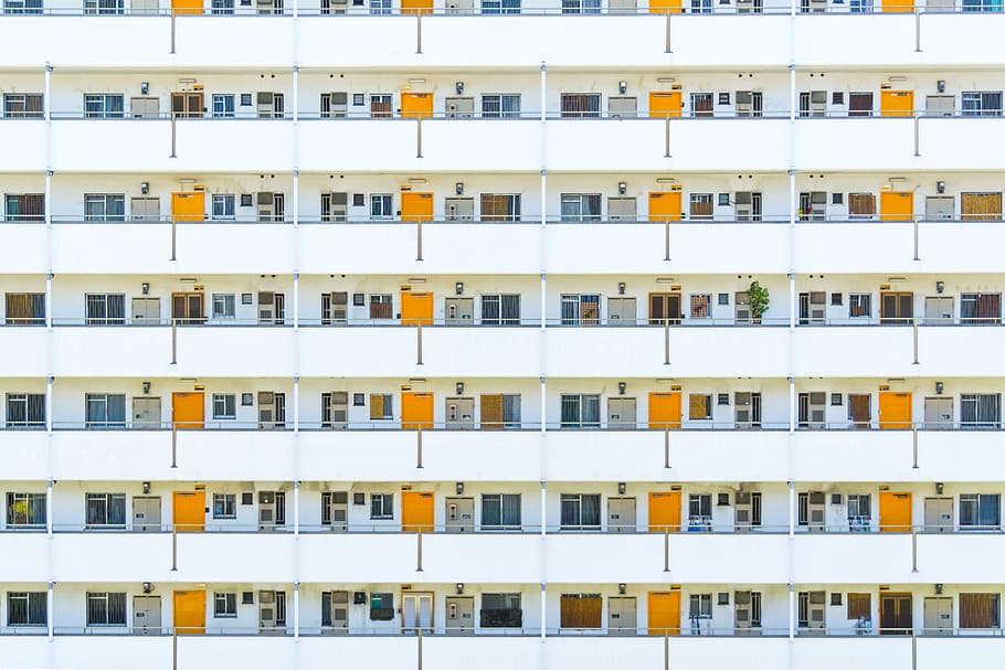 white concrete building during day time, white apartment building with yellow doors HD wallpaper