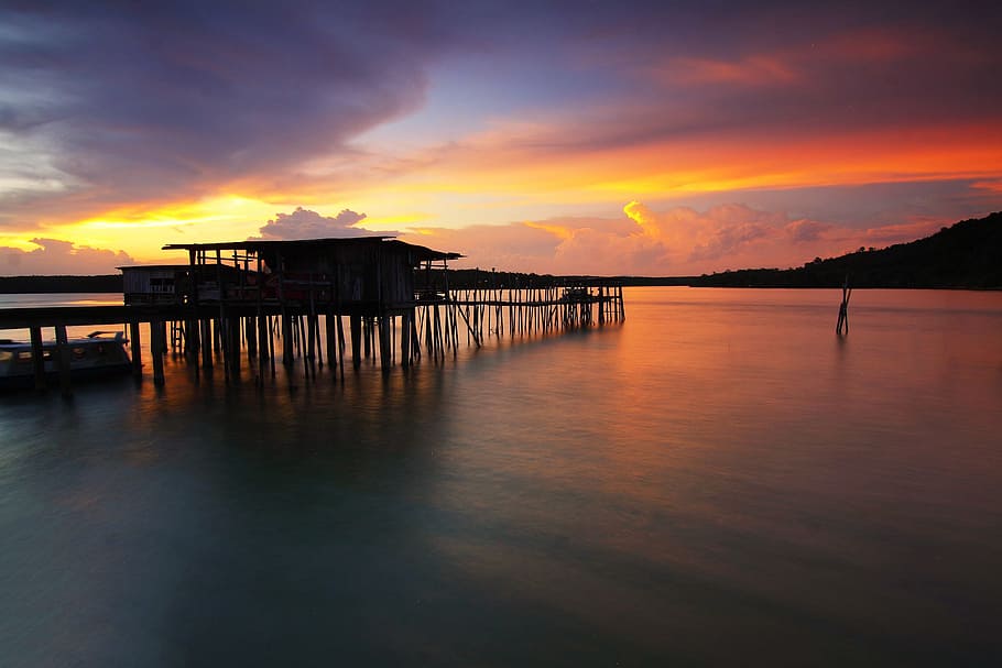 Silhouette of Wooden House Above Sea during Sunset, beach, boat HD wallpaper
