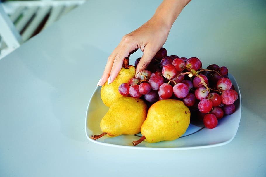person holding pears and grapes on plate, fruit, morning, hand HD wallpaper