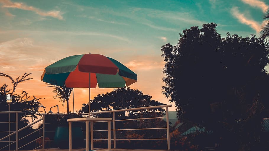 Red, Blue and Green Patio Umbrella, beach, clouds, dawn, daylight HD wallpaper
