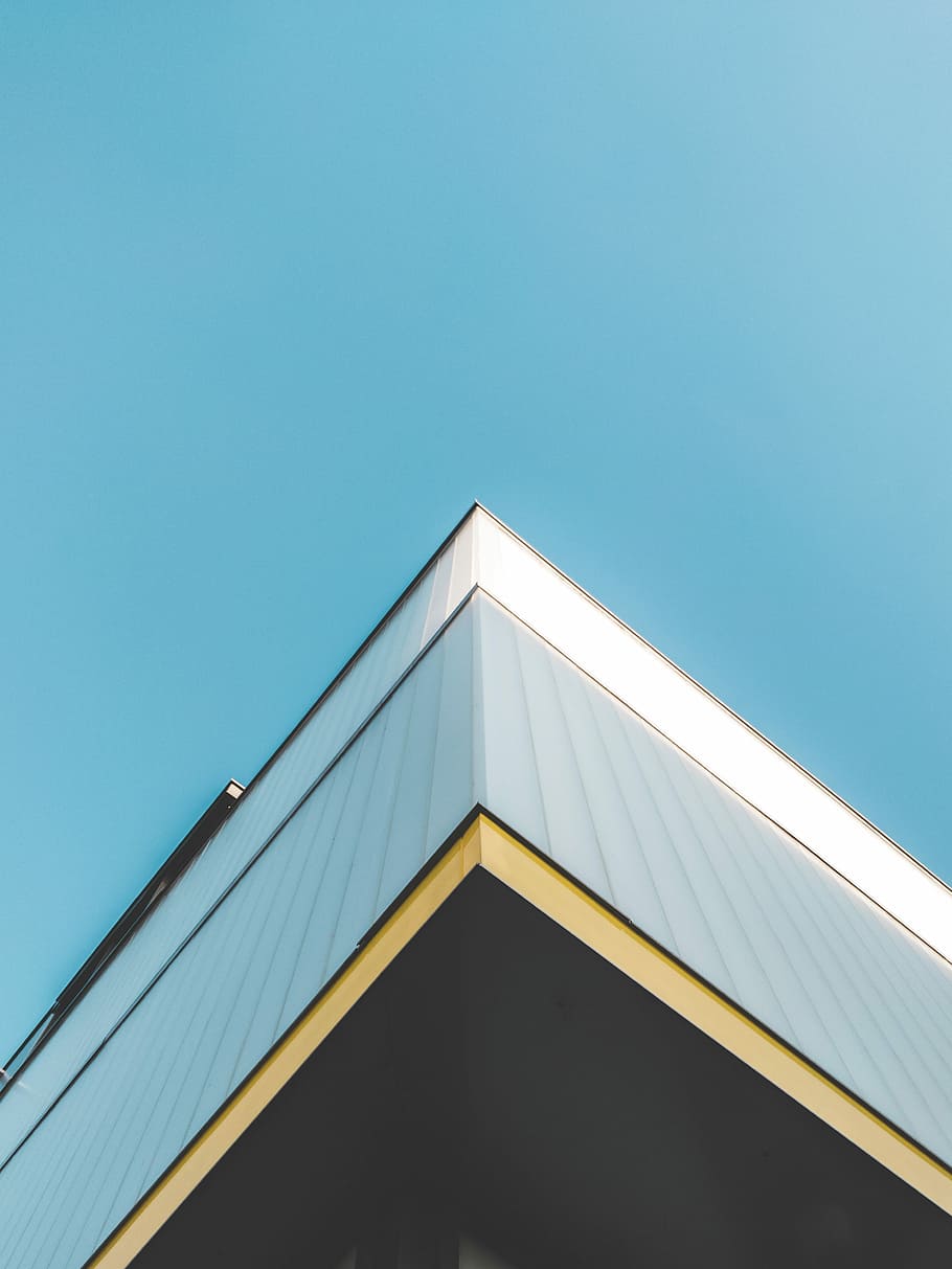 worm's eye view photo of building during daytime, white concrete building under blue sky HD wallpaper