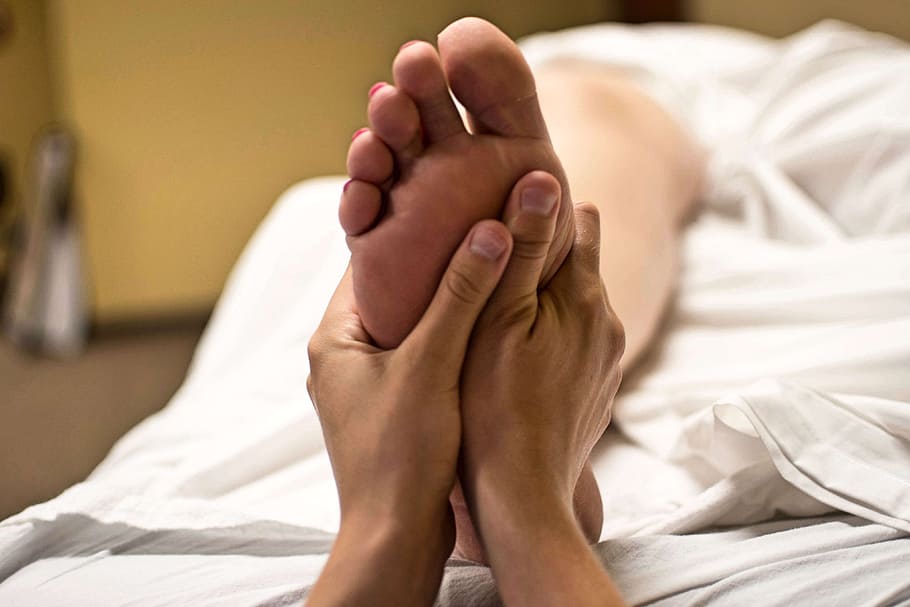 photo of person pressing person's foot, Foot Massage, Reflexology