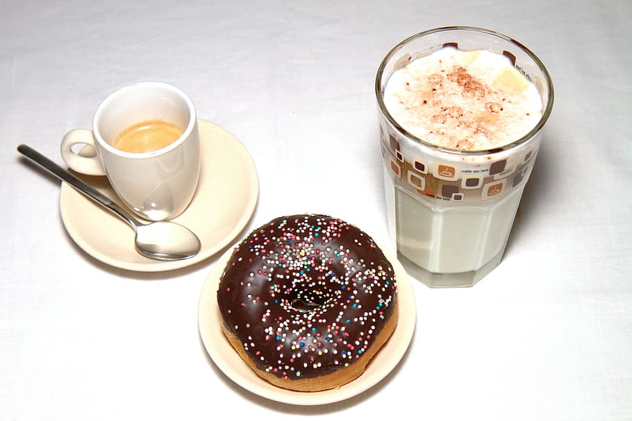 chocolate donut on saucer; cup of milkshake; and cup of coffee with spoon on saucer HD wallpaper