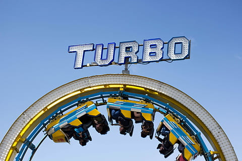 person riding on yellow and blue Turbo roller coaster, Turbo rollercoaster with people riding HD wallpaper