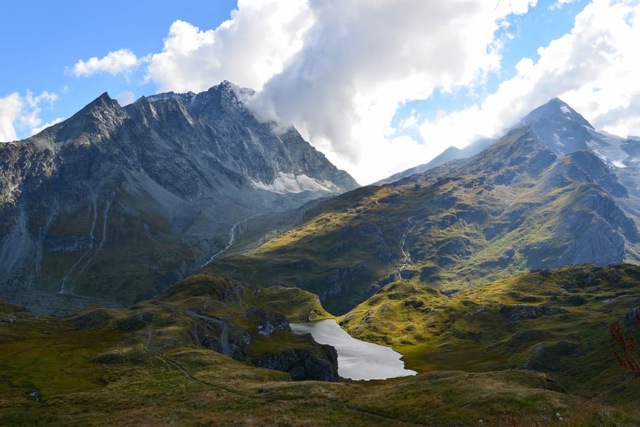 aerial view of mountain during day time, mountain under white cloudy sky during daytime HD wallpaper
