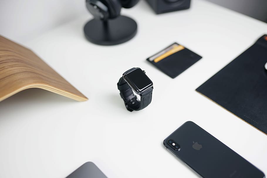 Apple Watch near space gray iPhone X on table, desk, workspace HD wallpaper