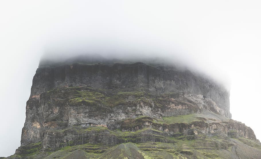 mountain view on cloudy sky during daytime, green and gray plateau covered with fog HD wallpaper