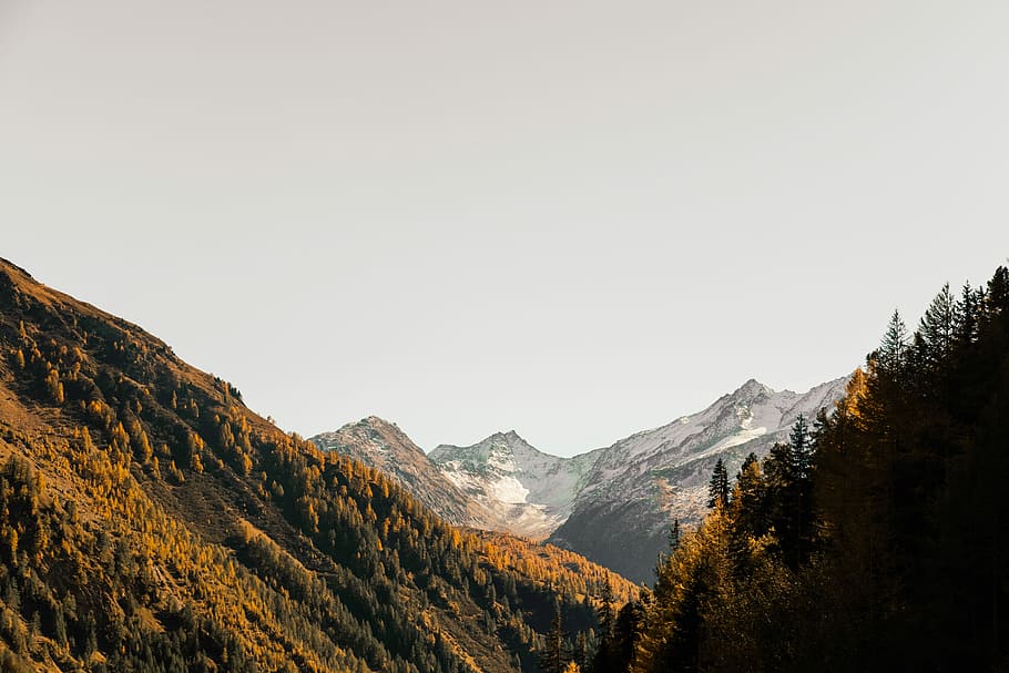 aerial photography of mountain under cloudy sky, gray mountain during daytime HD wallpaper