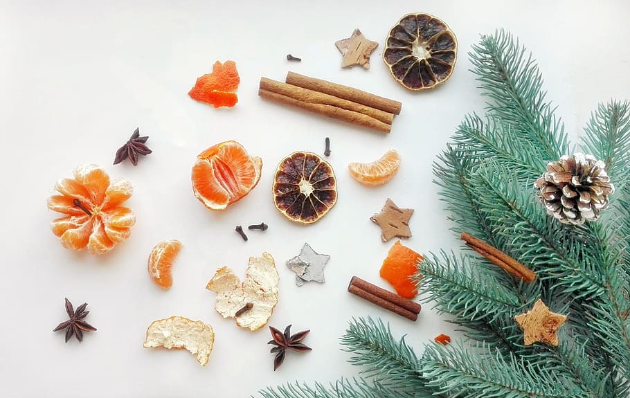 flat lay photography of cinnamon sticks with star anise and peeled orange HD wallpaper
