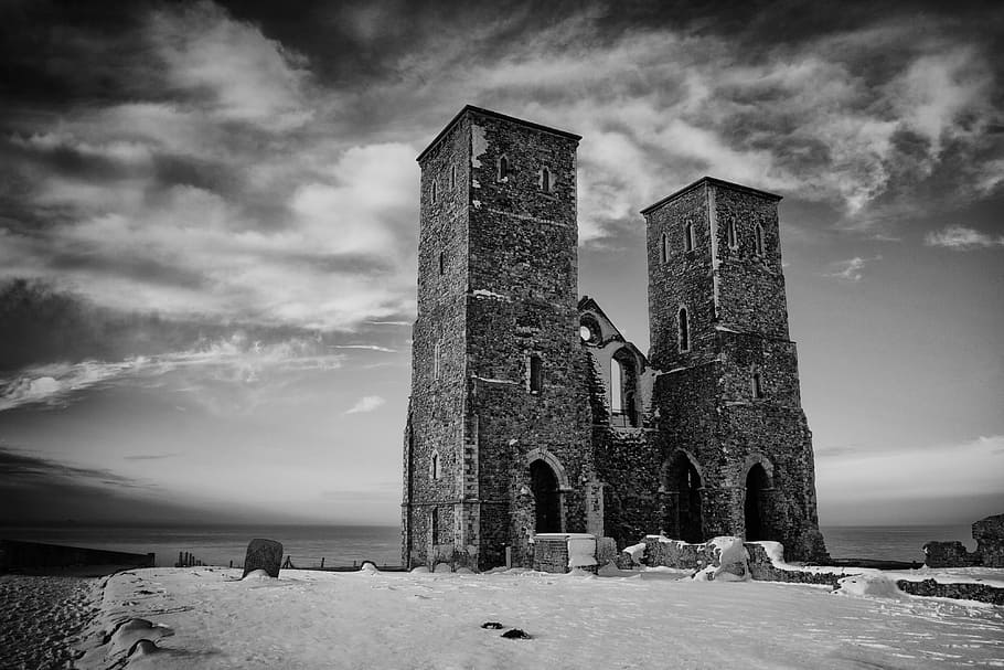 An old Saxon pair of towers sit on top of the cliffs at Reculver, Kent, England HD wallpaper
