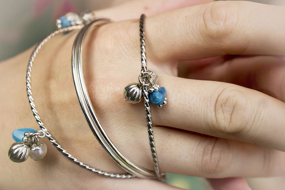 person's silver bangles on wrsit, jewelry, fashion, beauty, girl, HD wallpaper