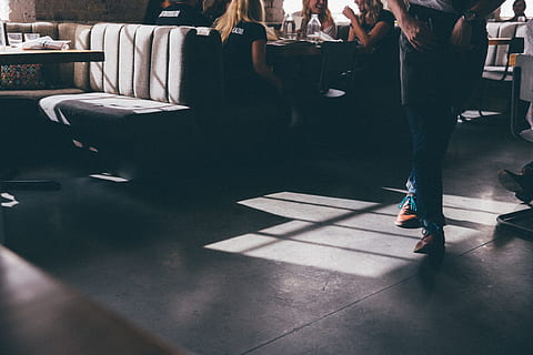 person in pair of brown shoes indoor, person walking near table HD wallpaper