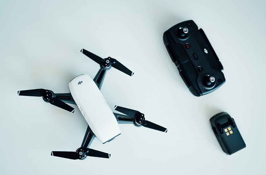 white and black quadcopter drone on white table, DJI Mavic drone near remote, HD wallpaper