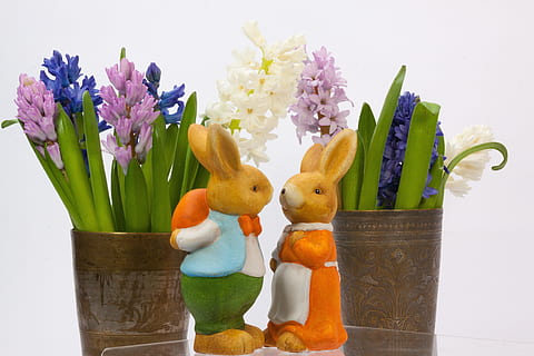 two brown rabbit figurines beside plants, easter bunny, hare HD wallpaper