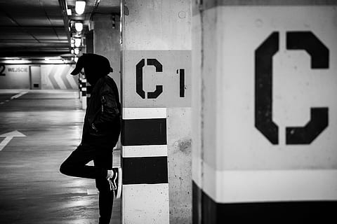 man leaning on white concrete post, architecture, building HD wallpaper
