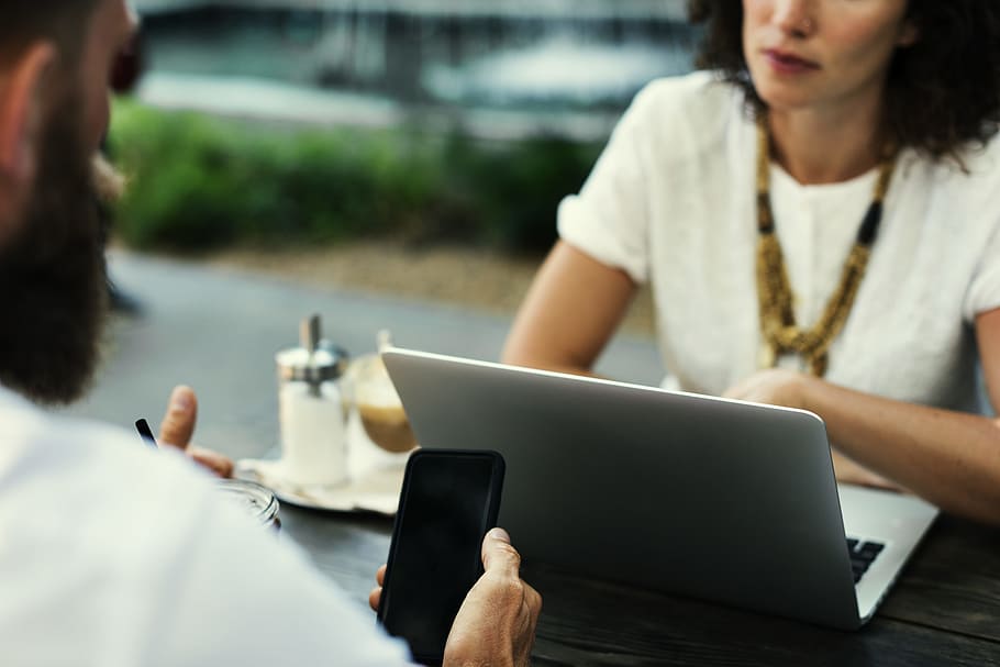 man, woman, smartphone, laptop, blur, close-up, daylight, focus HD wallpaper
